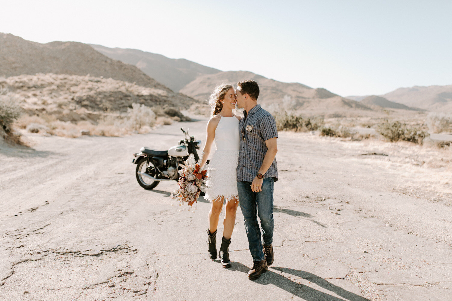 California-photographer-desert-groom-desert-Bride-fringe-dress-desert-elopement-Anza-Borrego-California-wedding-elopement-florals-triumph-motorcycles.jpg